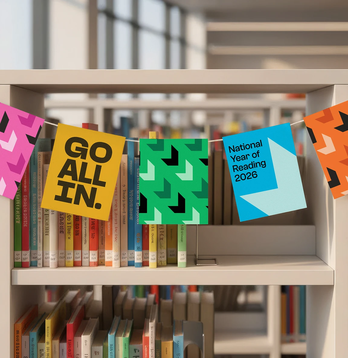 Campaign bunting displayed on bookshelves with “Go All In” and National Year of Reading logos