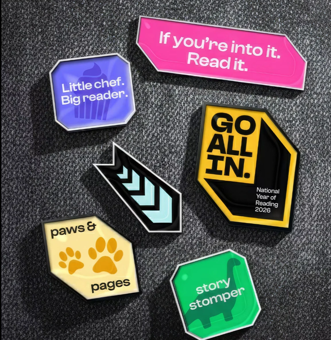 Collection of campaign badges and stickers with reading messages