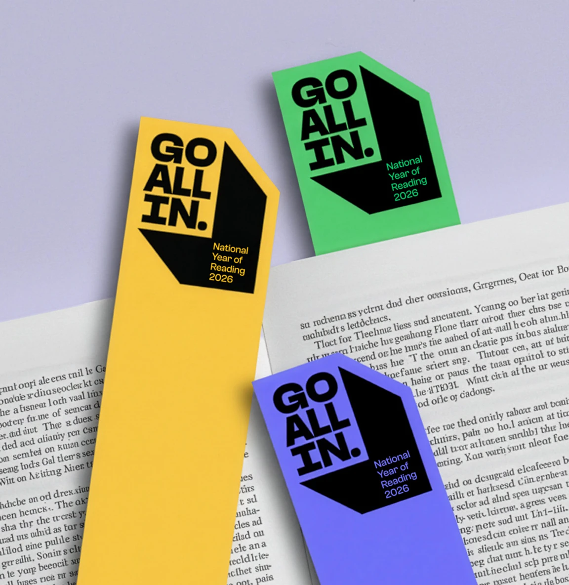 “Go All In” bookmarks placed inside an open book