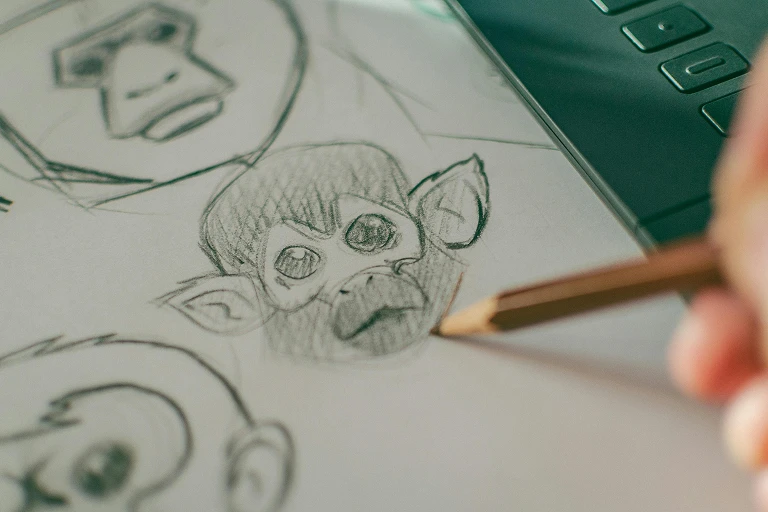 Close-up of a pencil drawing of a character on paper
