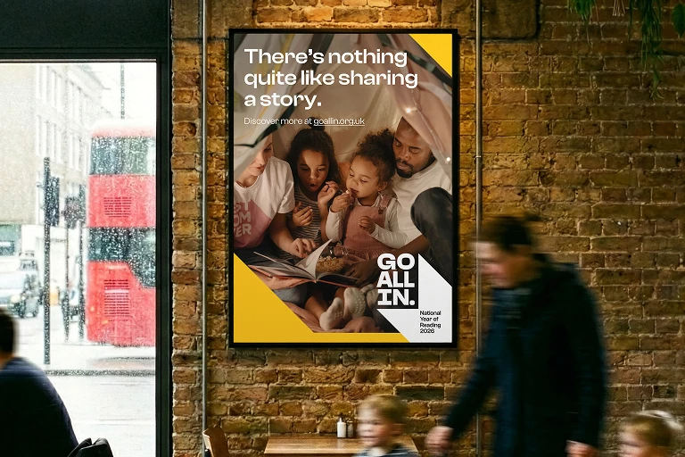 Poster showing people reading together with the text “There’s nothing quite like sharing a story”