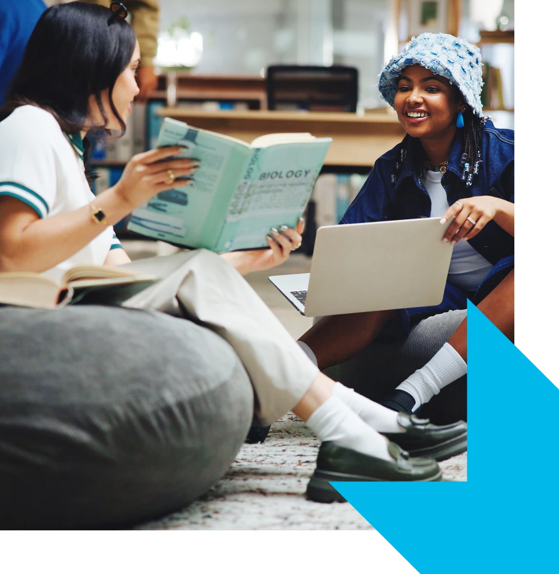 Adult reading a book while seated indoors