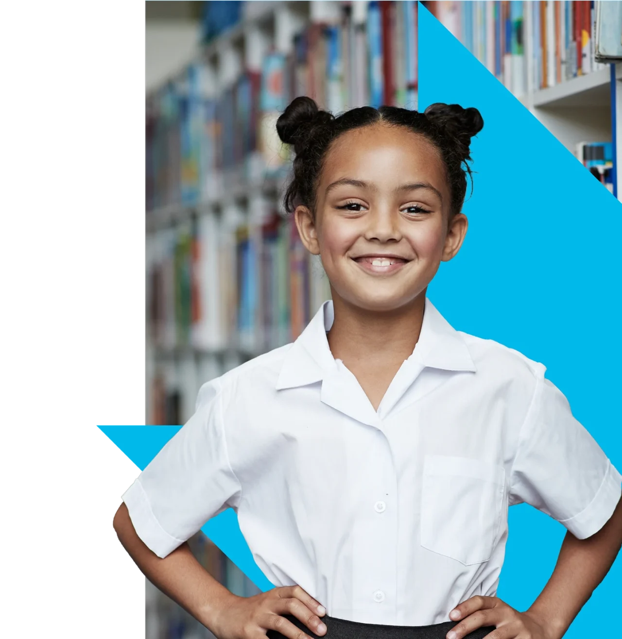Child standing and smiling in front of bookshelves