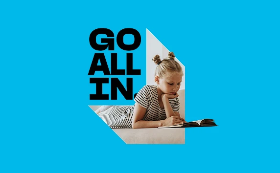 Campaign graphic showing a child reading with the text “Go All In”