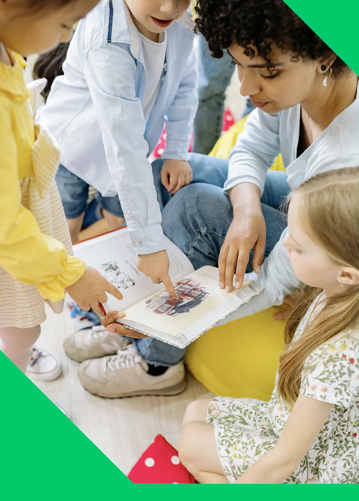 An early years practitioner leading story time with a group on young children