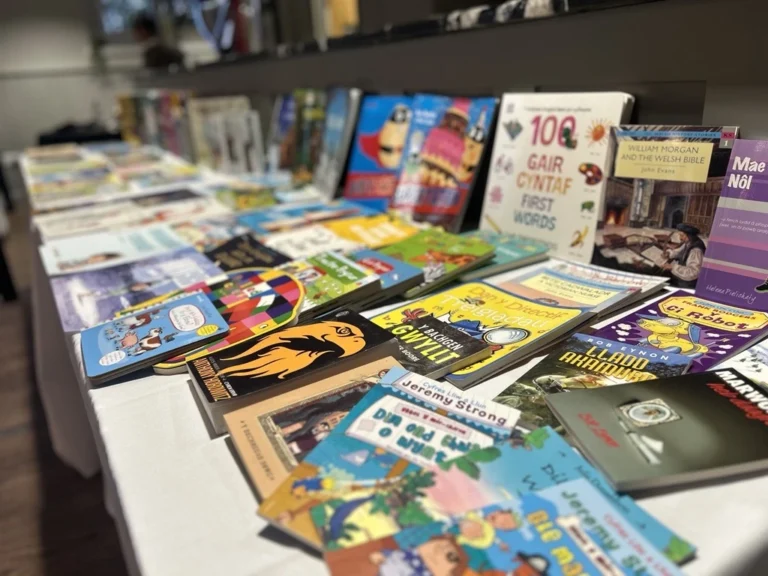 Magazines and books laid out on a display table