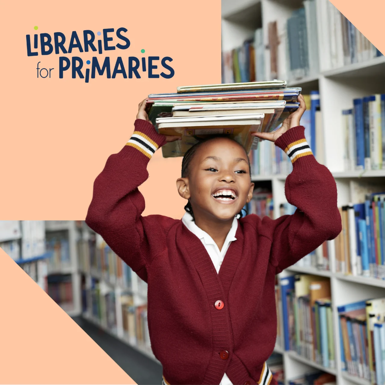 A young child at school carrying books in the library with a Libraries for Primaries logo