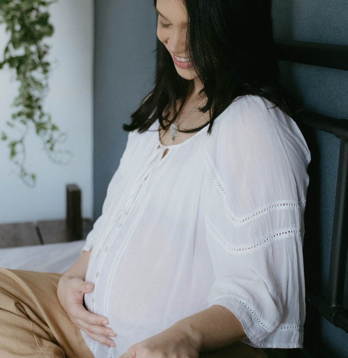 Expectant mother talking to her baby bump