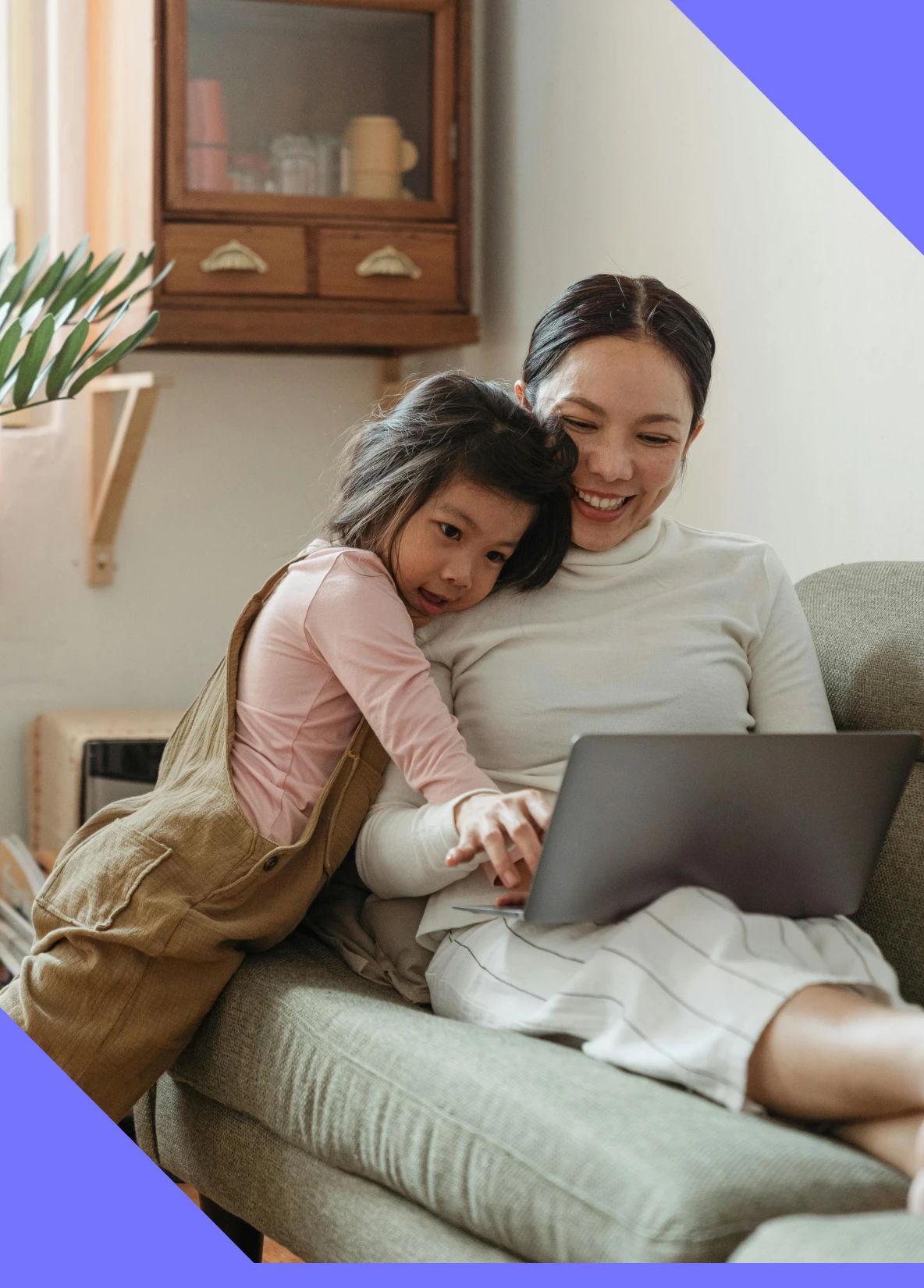 Mum with child on a laptop