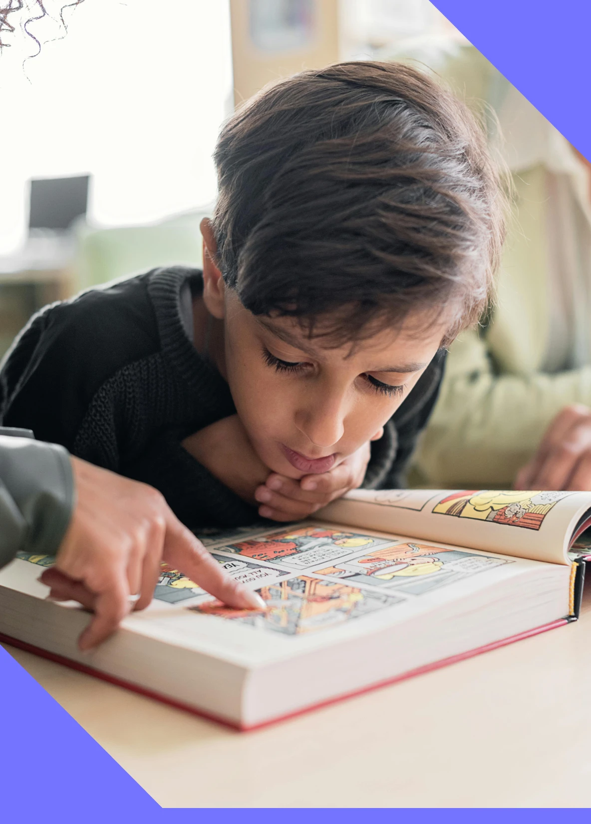 Boy getting support with a graphic novel